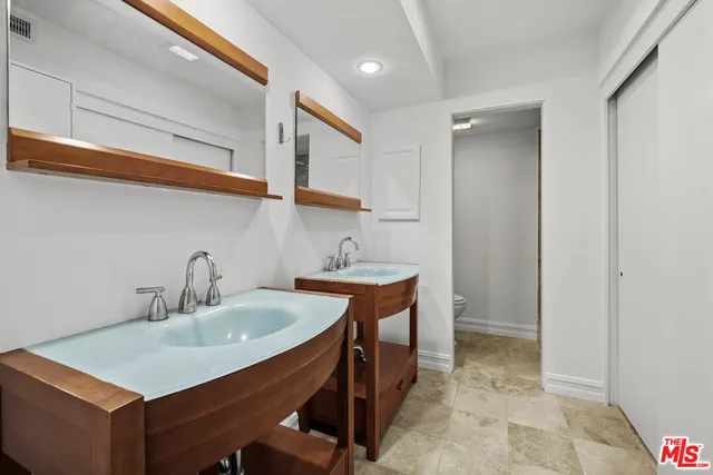 a kitchen with a sink cabinets and a stove