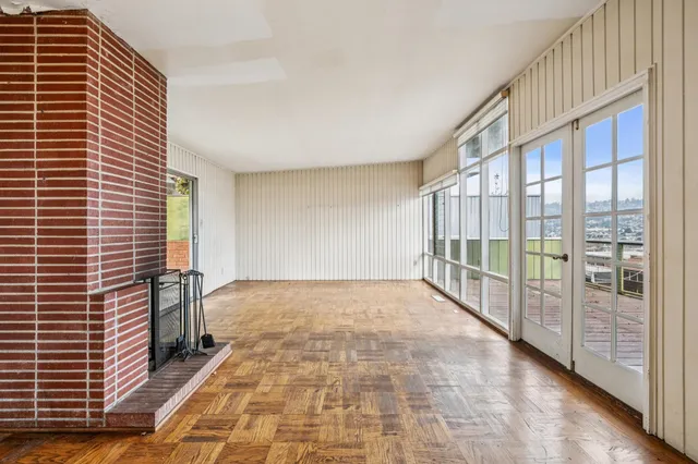 a view of an empty room with a large window