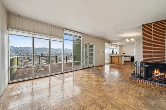 a view of a balcony with wooden floor and stairs