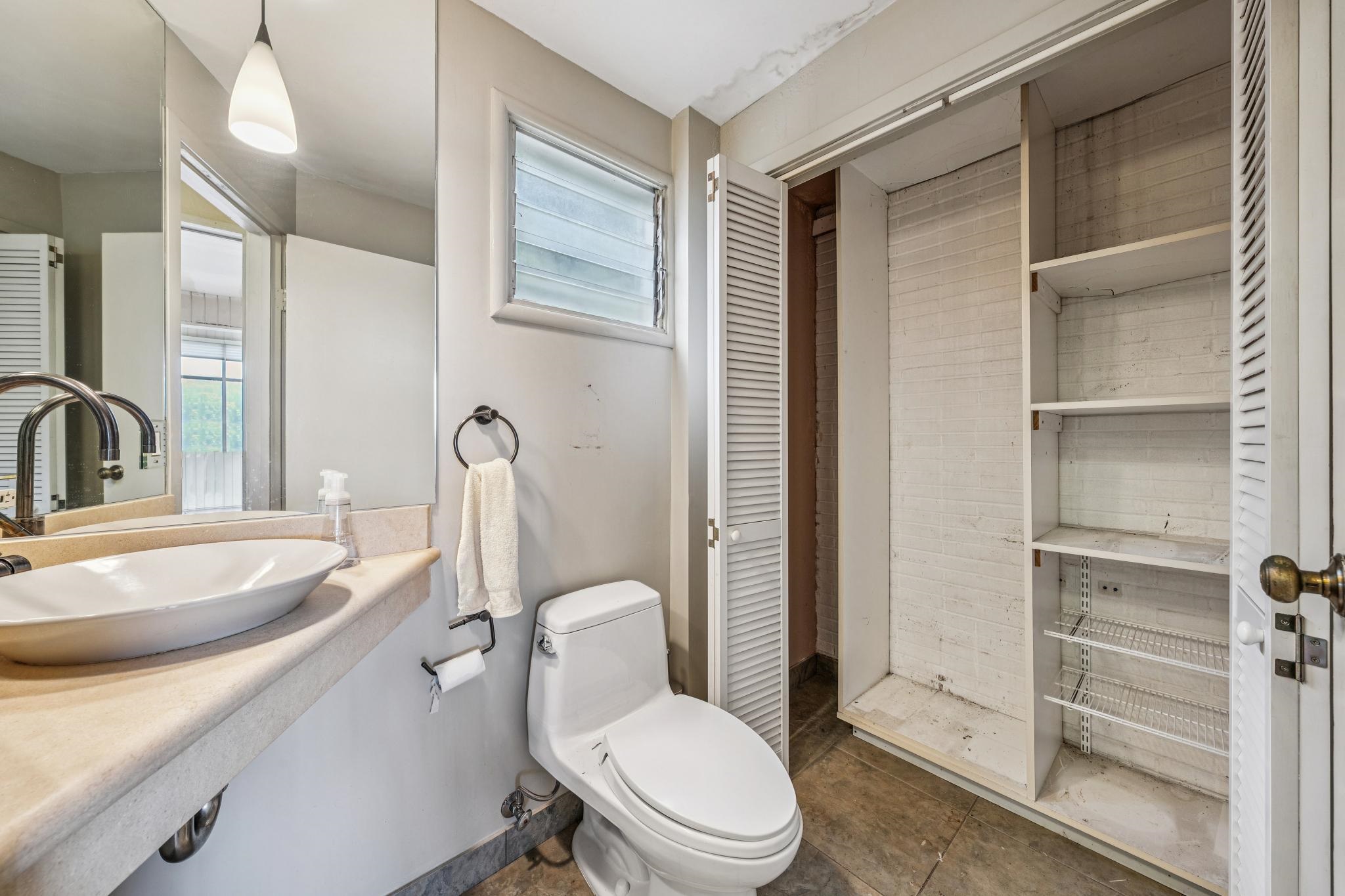 953 Hillside Avenue Albany, CA 94706 - Photo 32 of 48 a bathroom with a sink a toilet a mirror and shower