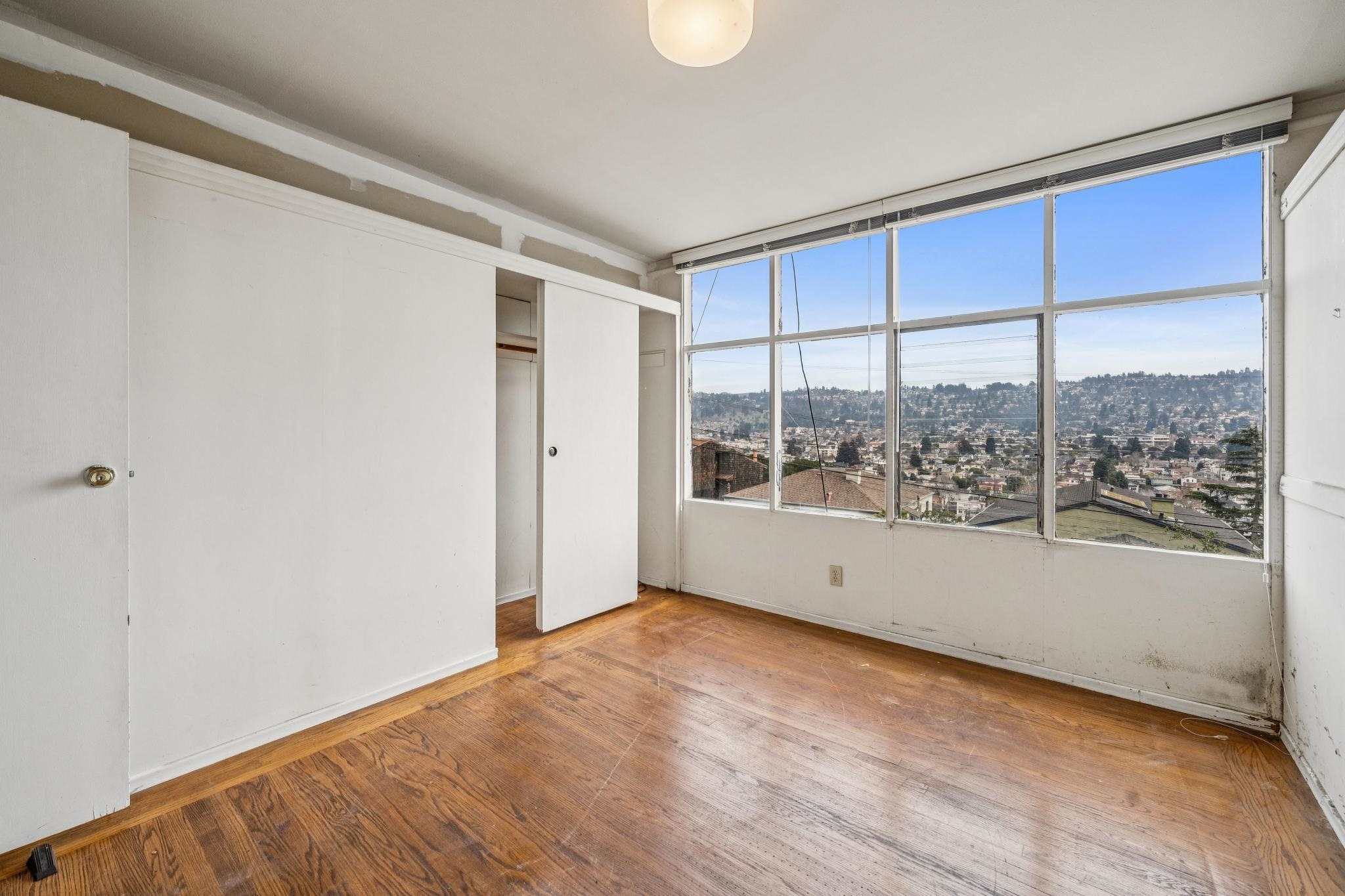 953 Hillside Avenue Albany, CA 94706 - Photo 41 of 48 a view of empty room with wooden floor and fan