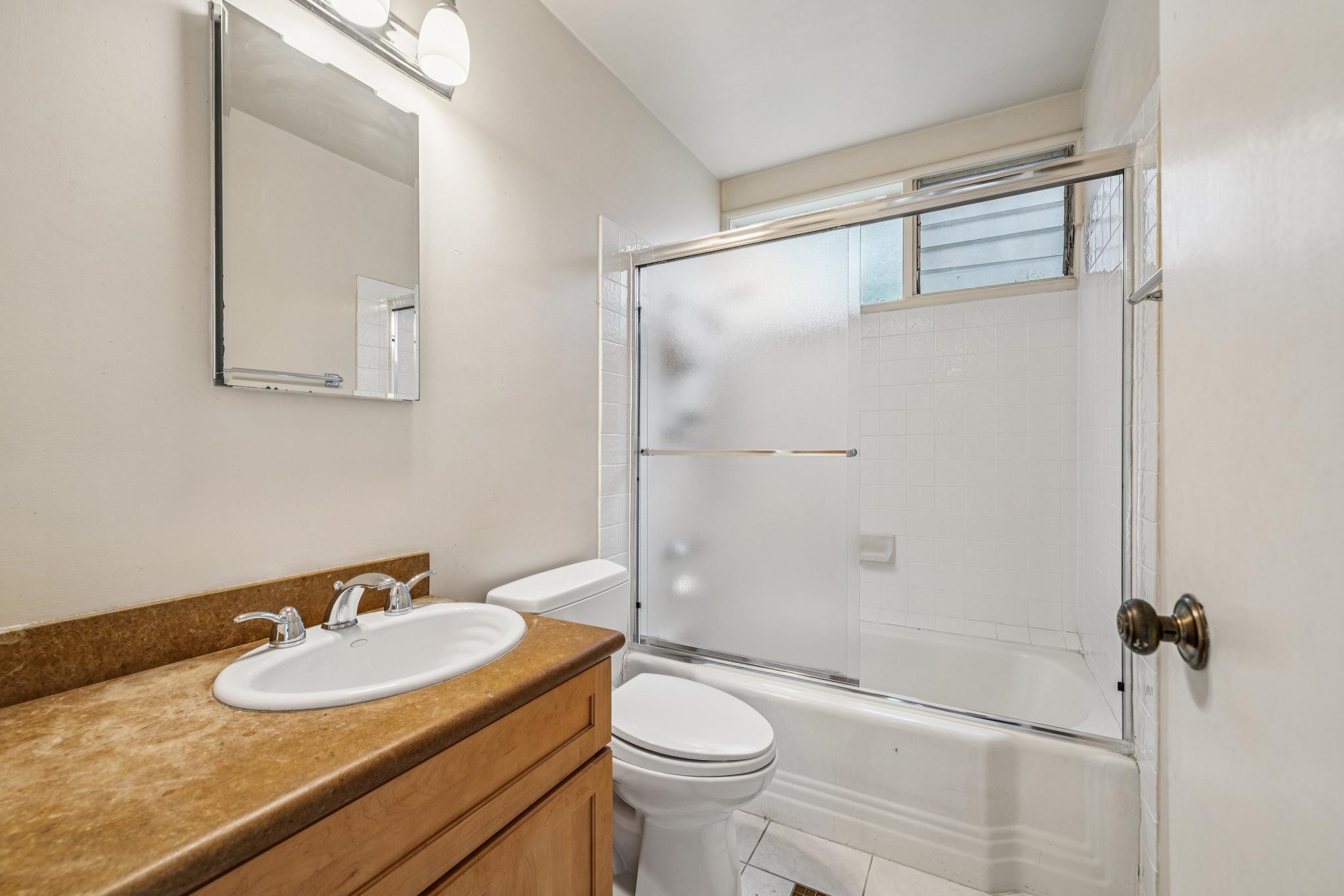 953 Hillside Avenue Albany, CA 94706 - Photo 43 of 48 a bathroom with a sink toilet and shower