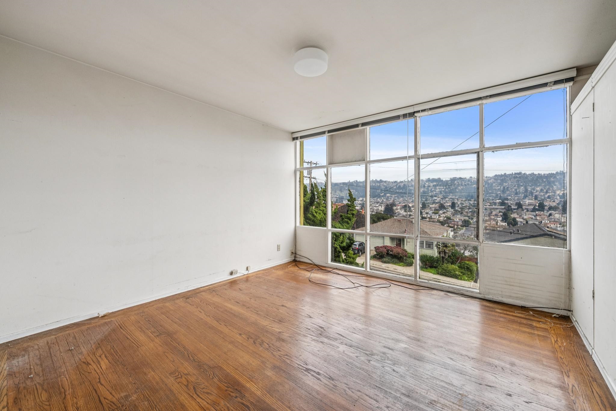 953 Hillside Avenue Albany, CA 94706 - Photo 45 of 48 a view of room with window and wooden floor