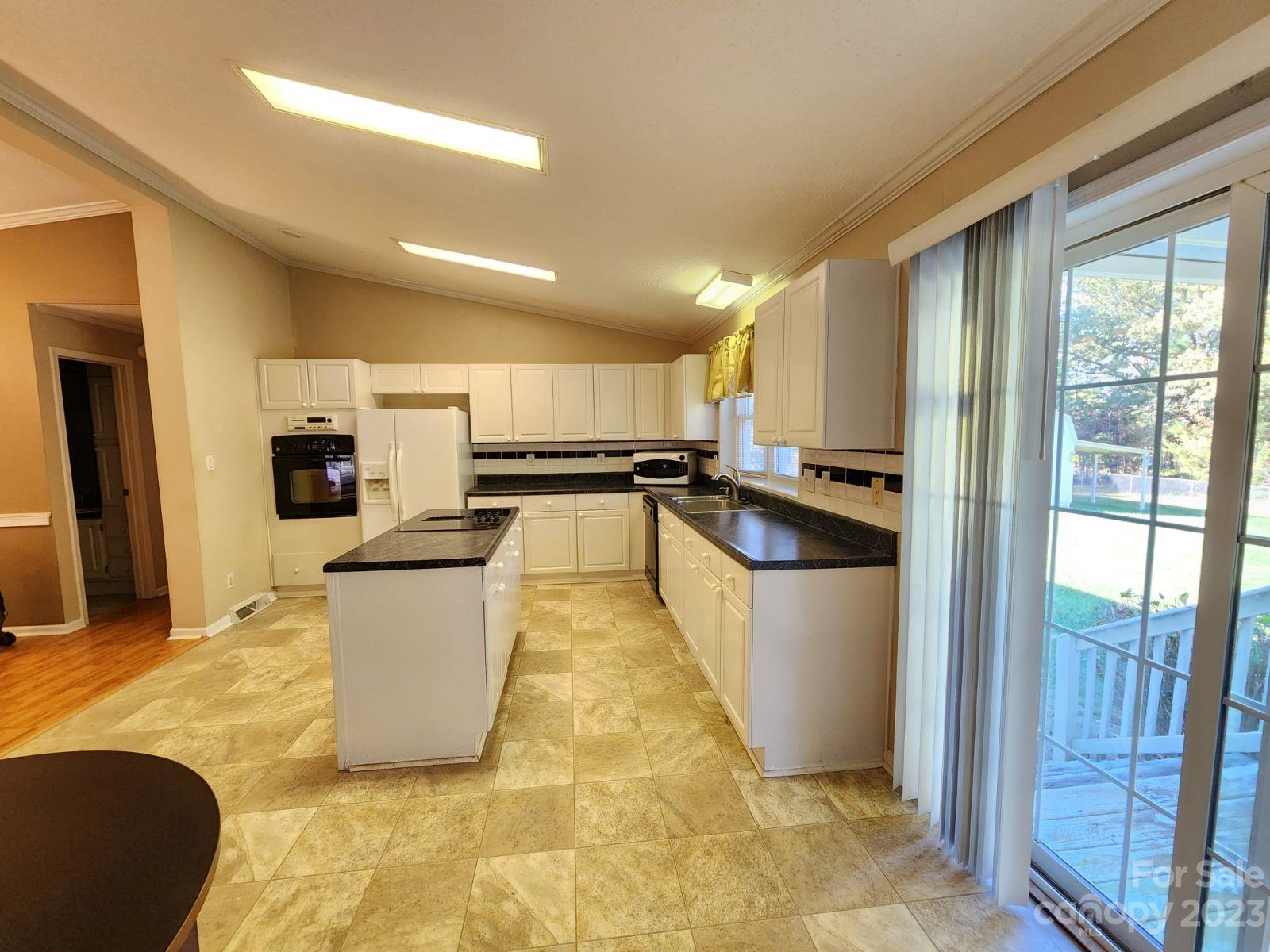 1952 Haire Road Fort Mill, SC 29715 - Photo 12 of 27 a kitchen with stainless steel appliances granite countertop a refrigerator a stove and a sink