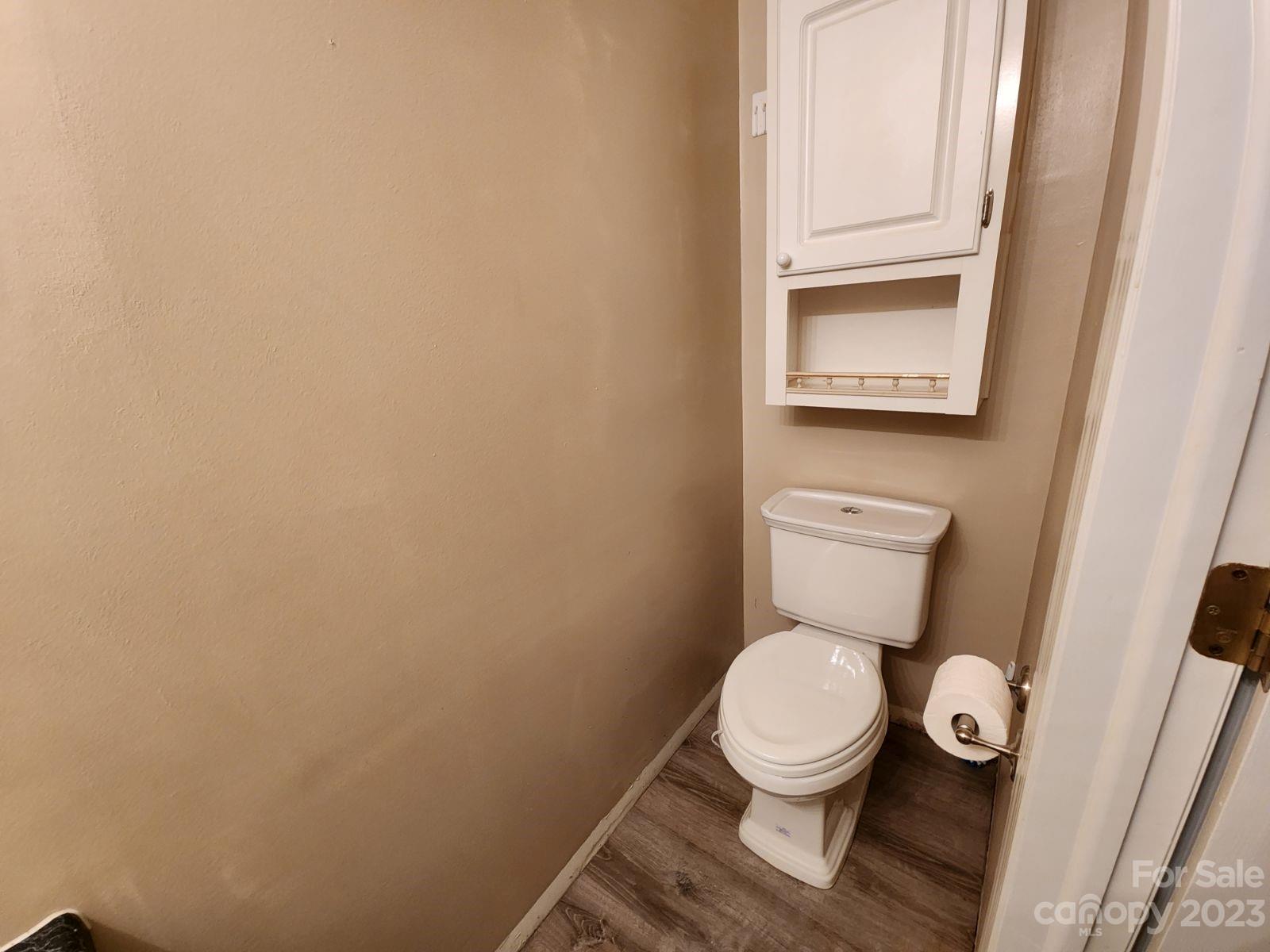1952 Haire Road Fort Mill, SC 29715 - Photo 17 of 27 a white toilet sitting next to a white cabinets
