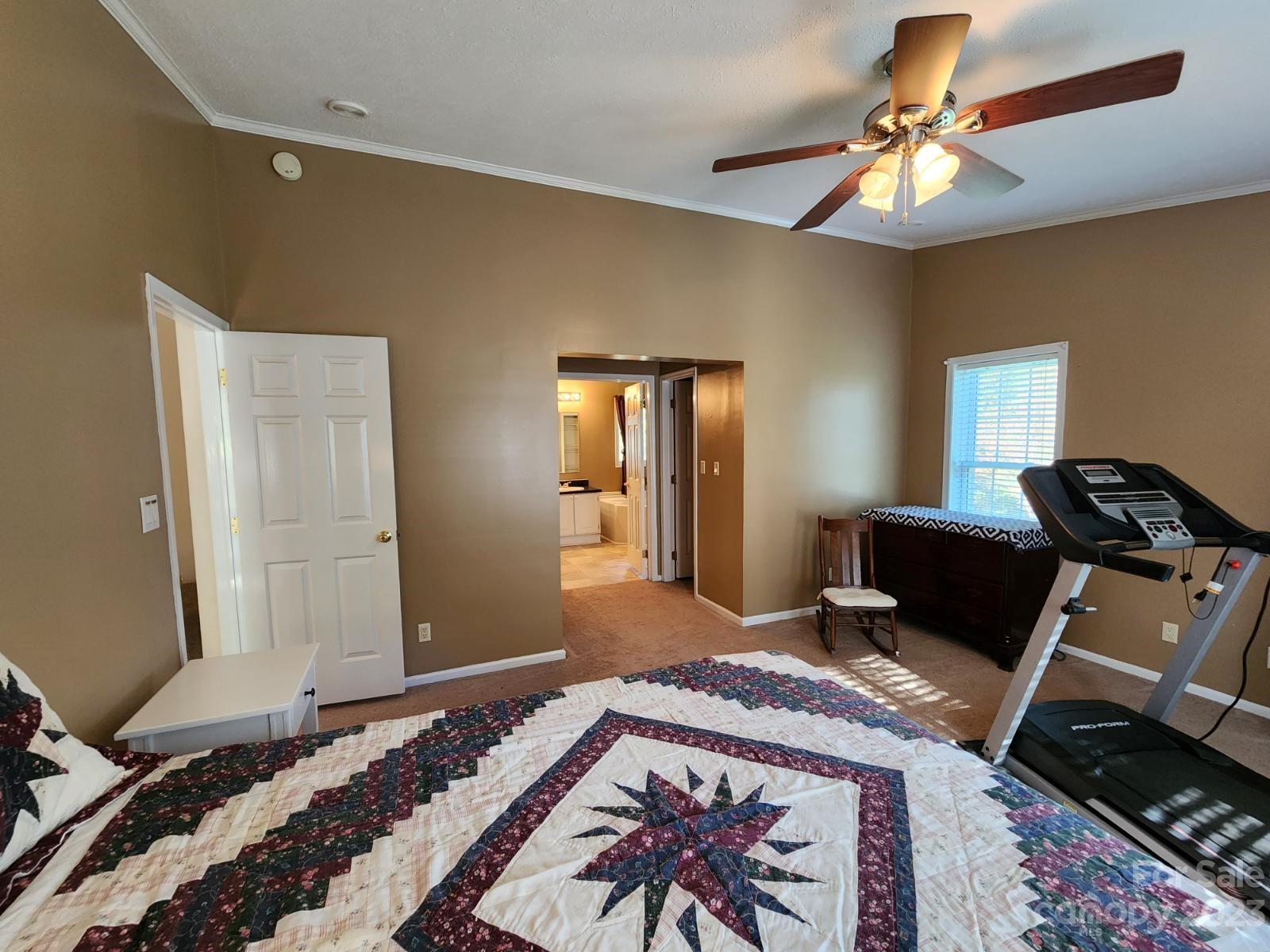 1952 Haire Road Fort Mill, SC 29715 - Photo 19 of 27 a bedroom with a bed and a chandelier