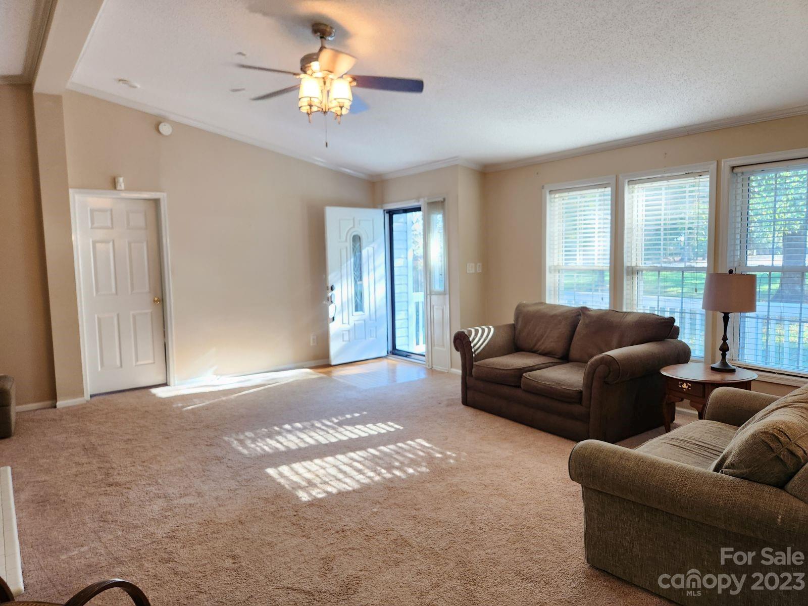 1952 Haire Road Fort Mill, SC 29715 - Photo 6 of 27 a living room with furniture and a chandelier