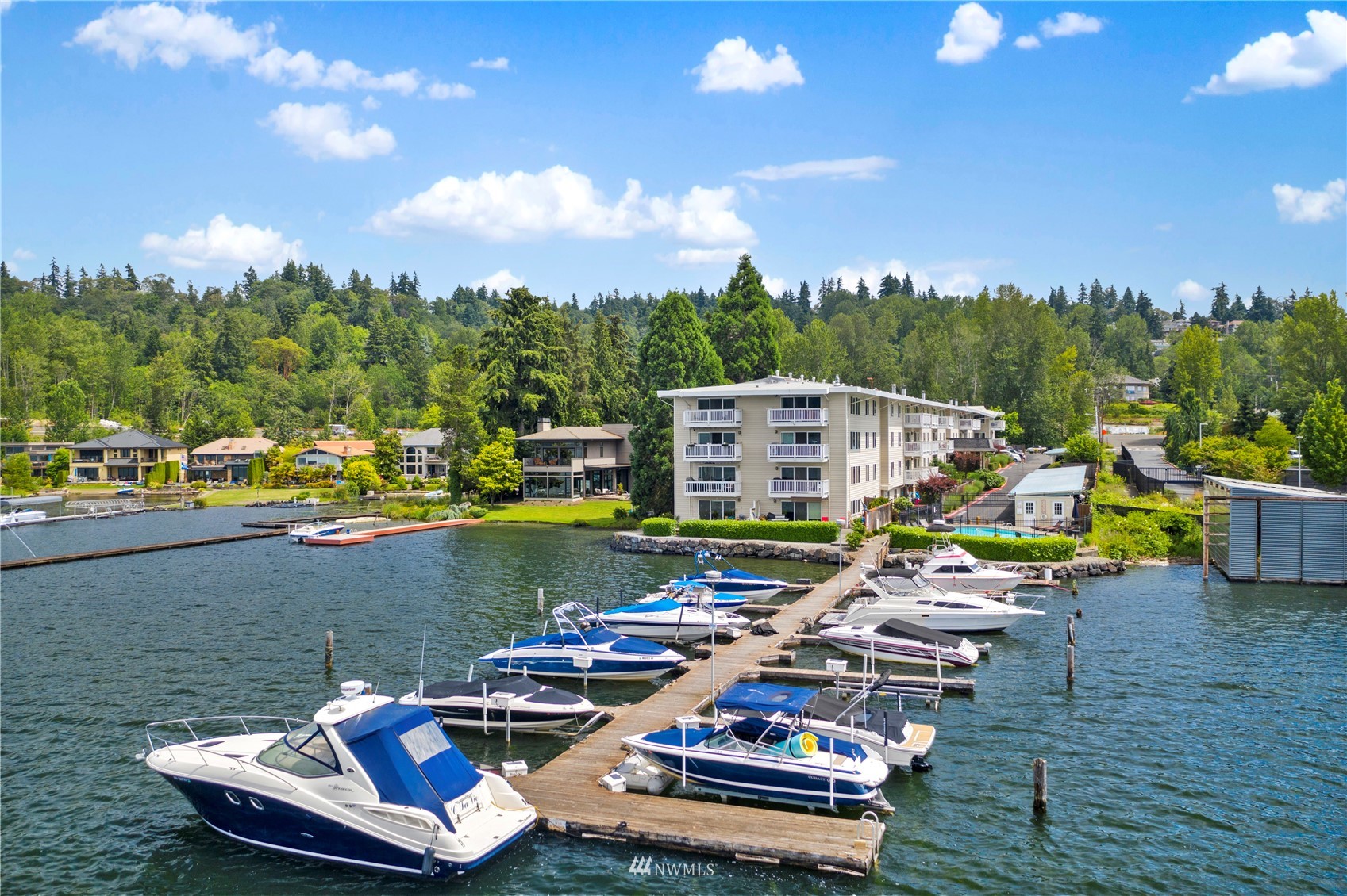 5021 Ripley Lane North, Unit 202 Renton, WA 98056 - Photo 27 of 35 a view of a lake with couches chairs in patio