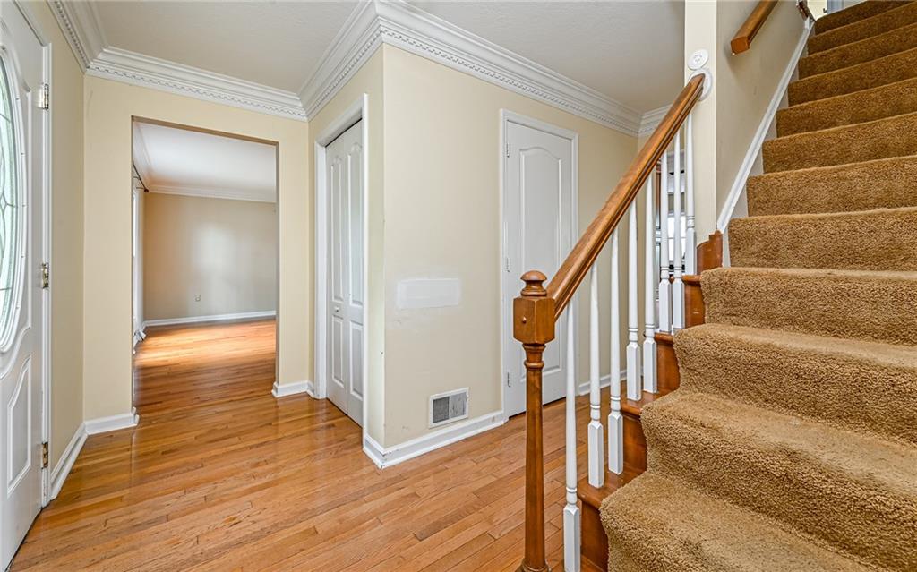 302 Ridgeway Drive Wexford, PA 15090 - Photo 17 of 28 a view of an entryway with wooden floor and door