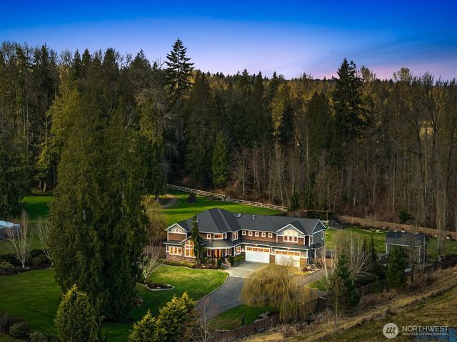 a view of a swimming pool with a table and chairs