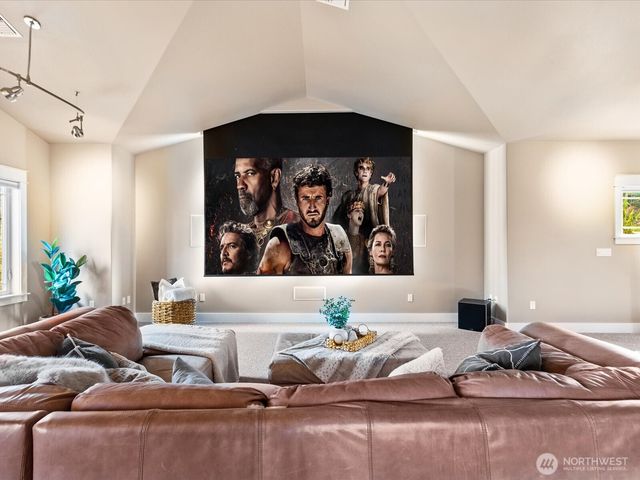 a living room with furniture and wall painting