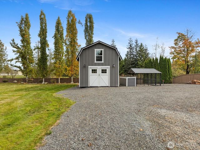 a house with trees in the background