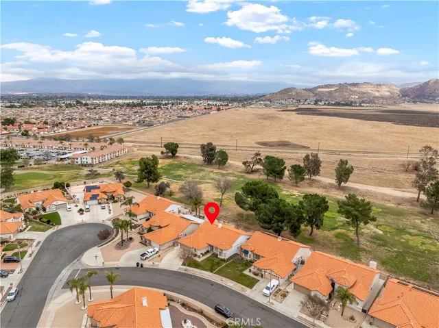an aerial view of residential building and lake