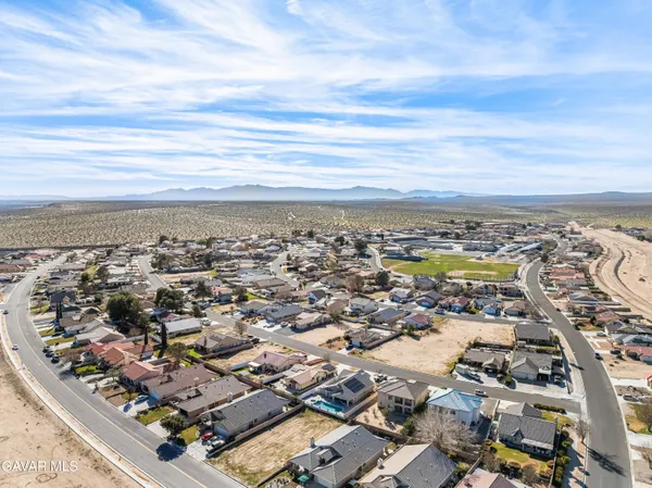 an aerial view of residential building with parking space