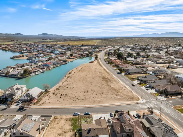 an aerial view of ocean and residential houses