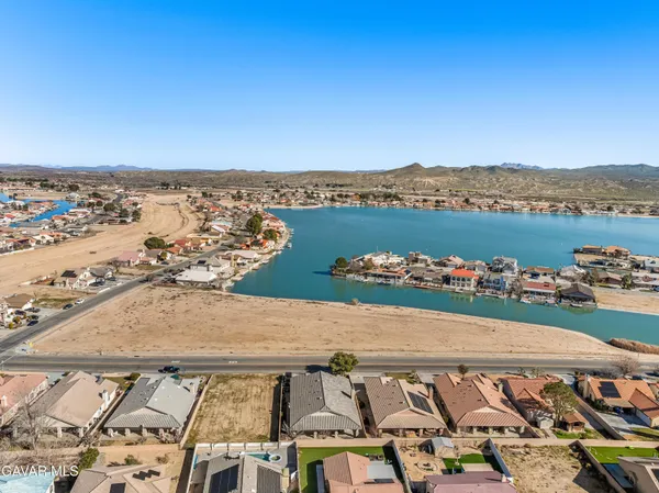 an aerial view of a house with outdoor space