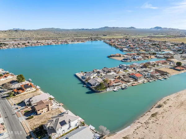 an aerial view of a house with a lake view