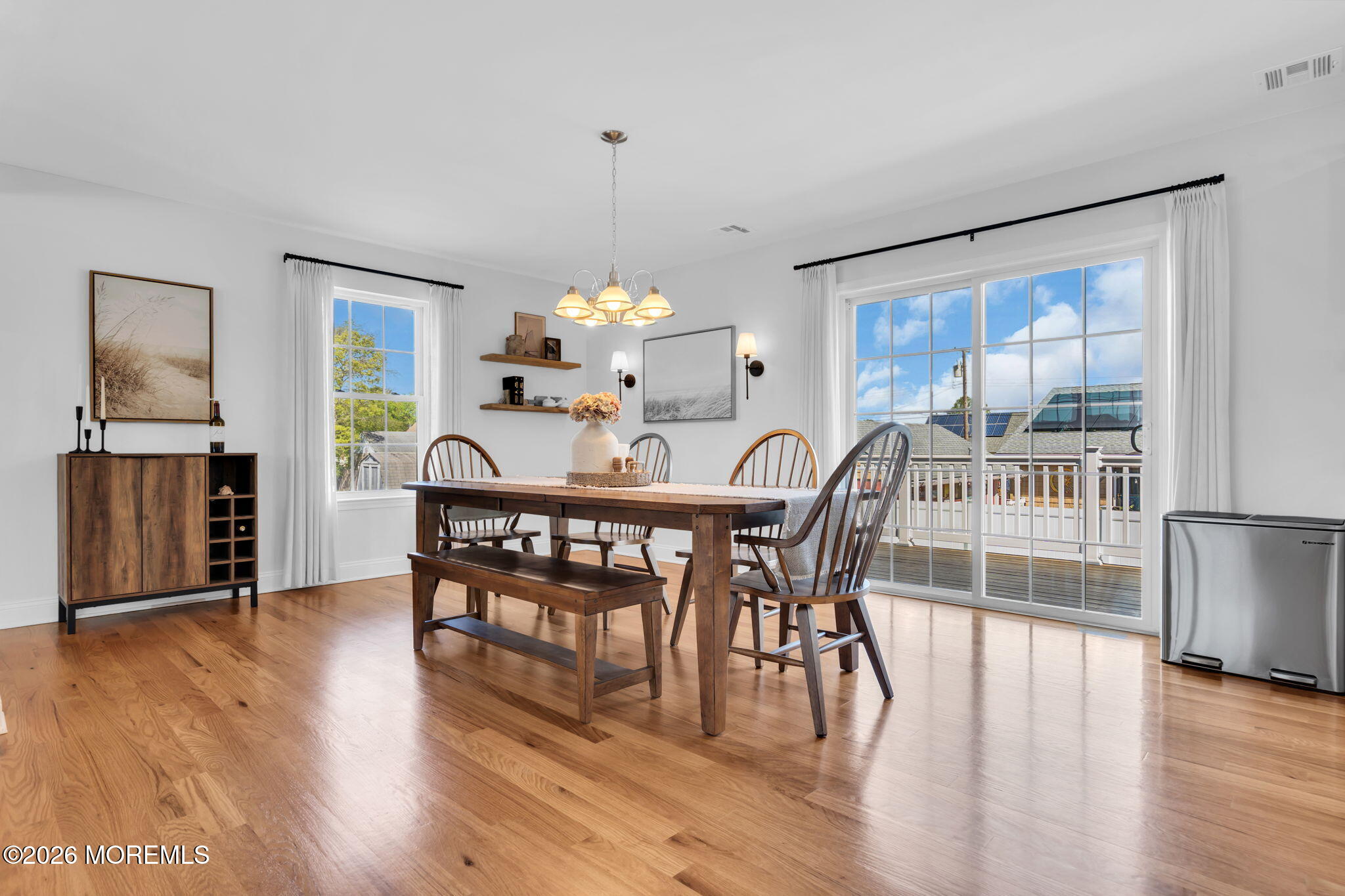 312 Beach Boulevard Forked River, NJ 08731 - Photo 7 of 40 a view of a dining room with furniture window and wooden floor