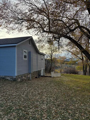 a backyard of a house with lots of green space