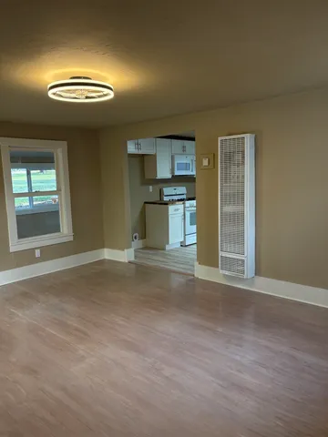 a view of a livingroom with a & a window