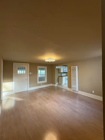 a view of a big room with windows and cabinet