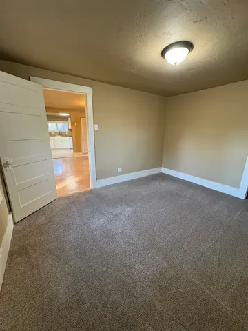 a view of an empty room with a window