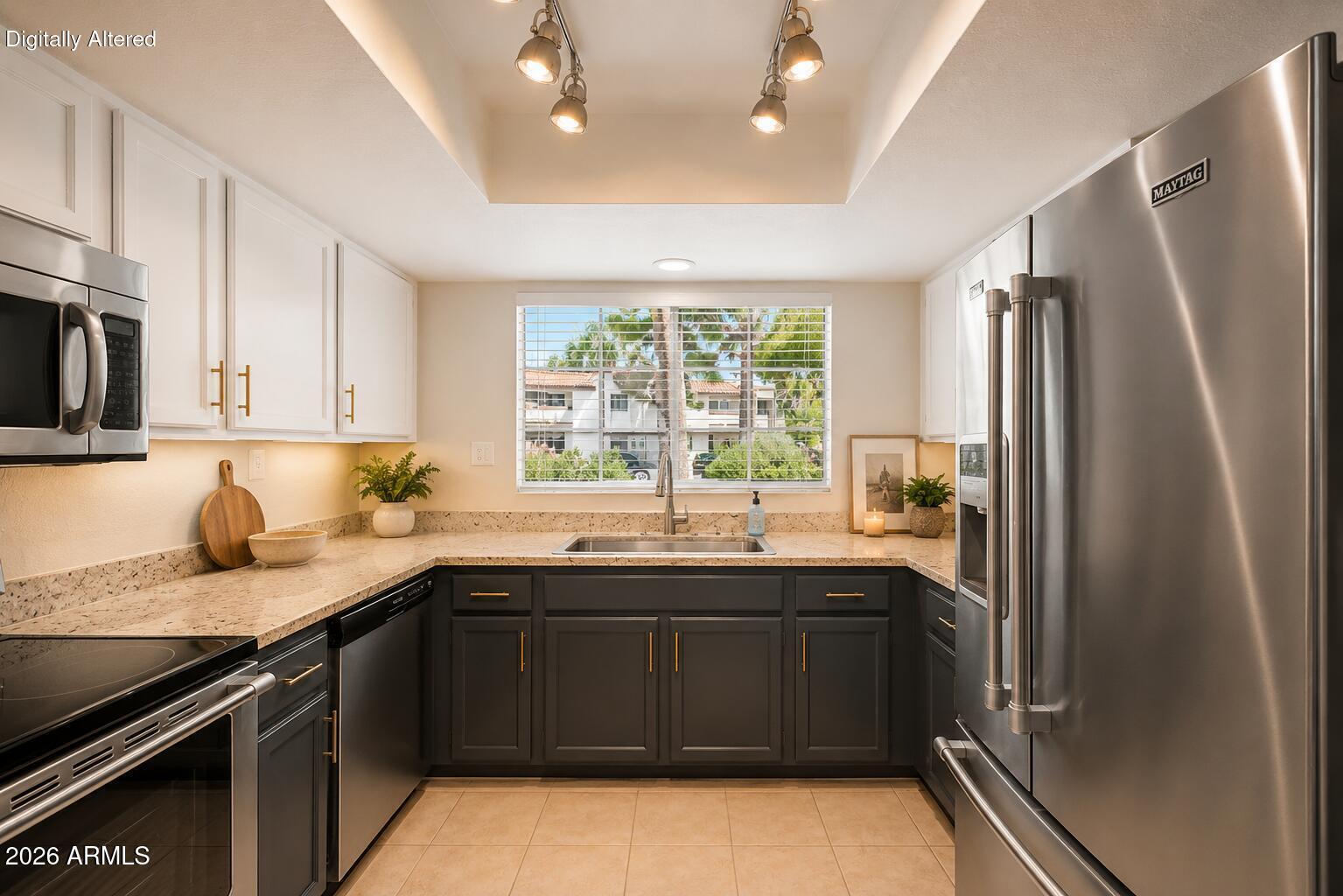 6885 East Cochise Road, Unit 142 Paradise Valley, AZ 85253 - Photo 5 of 47 a kitchen with a sink a stove and refrigerator