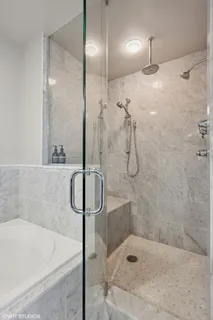a bathroom with a shower and a mirror