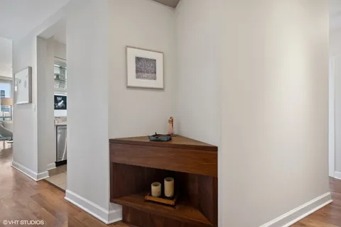 a room with a fireplace and a wooden floor