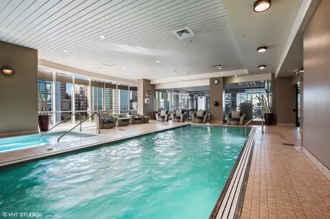 a view of a patio and swimming pool table and chairs