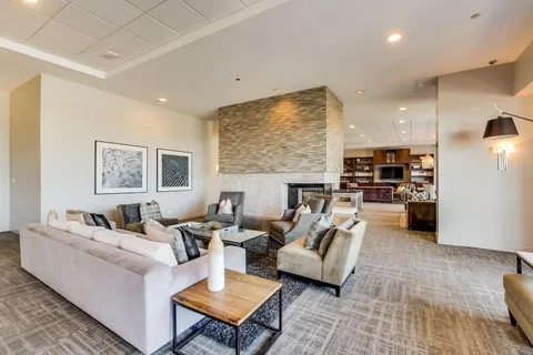 a living room with furniture and a table