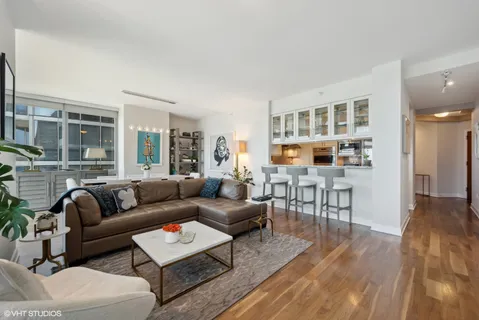 a living room with furniture and a table