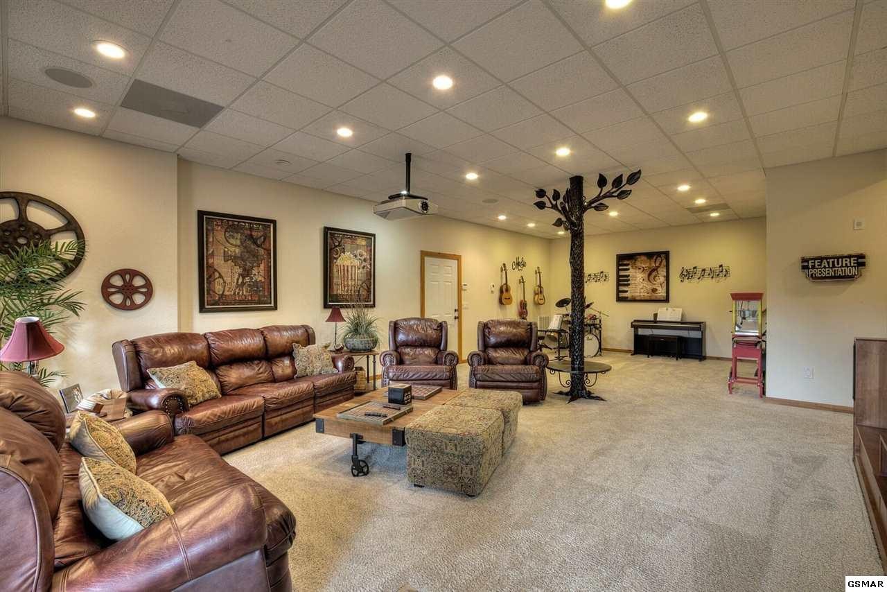 796 Deer Ridge Drive Rutledge, TN 37861 - Photo 23 of 35 a living room with furniture and couches with kitchen view