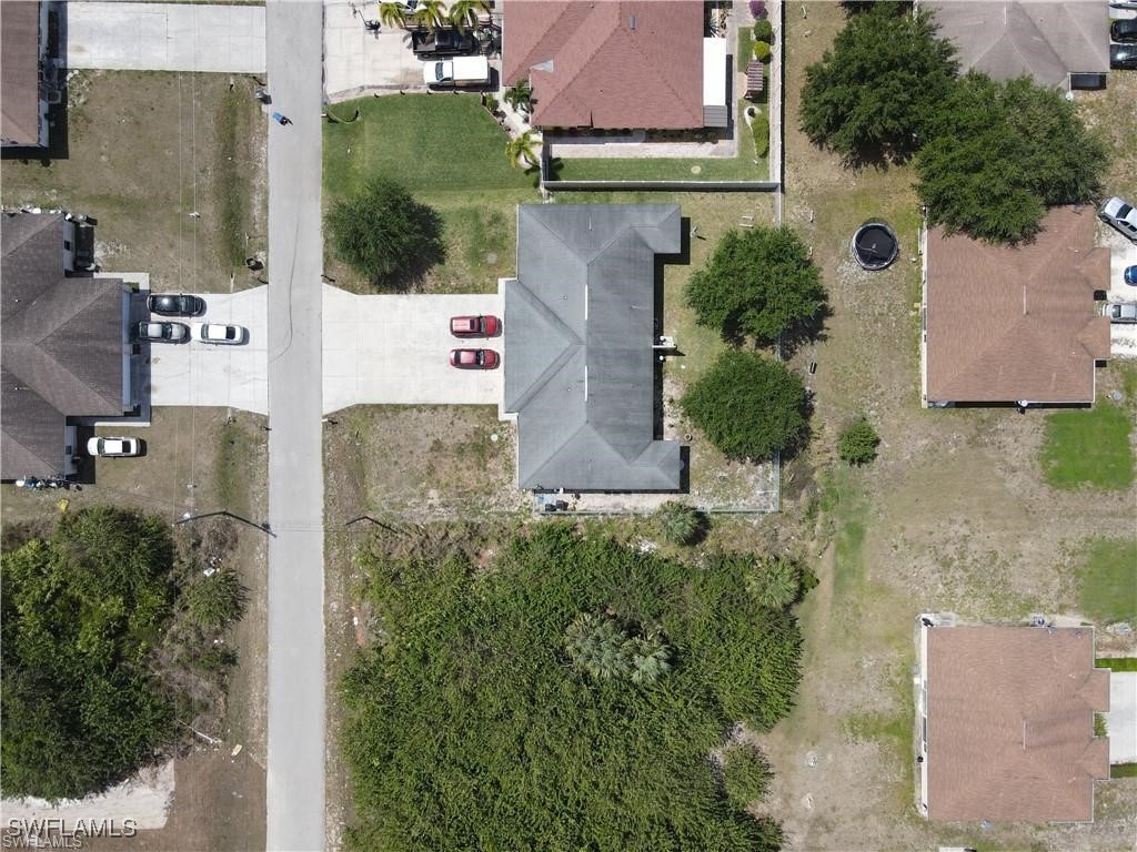4520 19th Street Southwest Lehigh Acres, FL 33973 - Photo 3 of 11 an aerial view of residential houses with outdoor space and street view