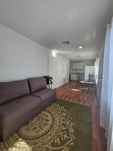 a living room with furniture and a rug