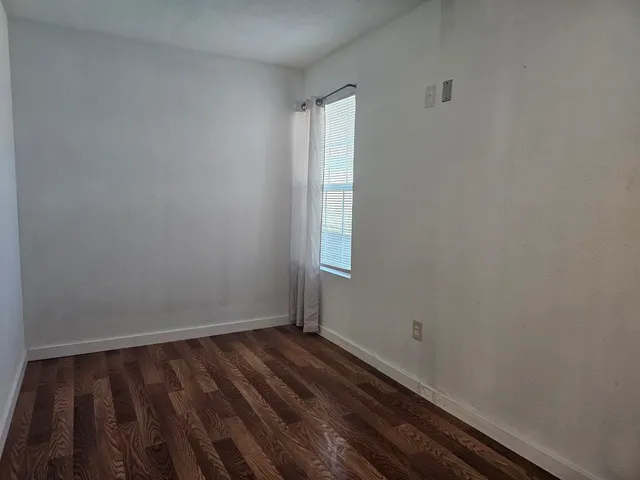 a view of an empty room and window