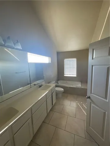 a view of a livingroom with a ceiling fan and window