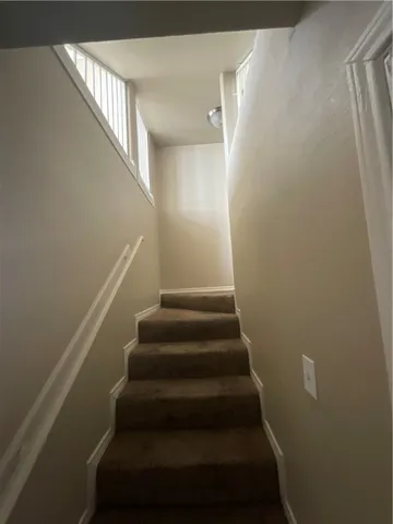 a view of a room with staircase