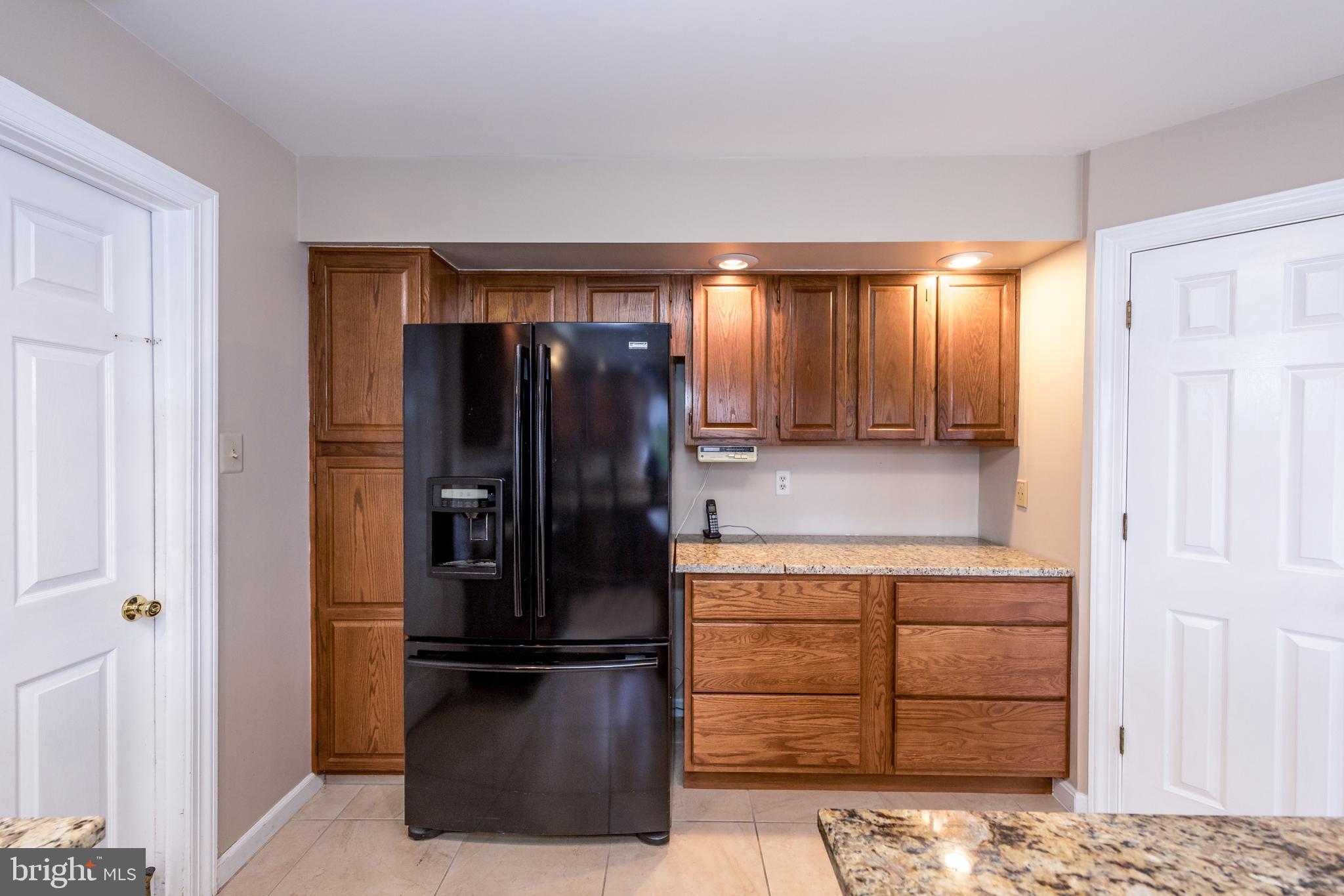 2502 Lady Ann Court Churchville, MD 21028 - Photo 18 of 48 a kitchen with a refrigerator and cabinets