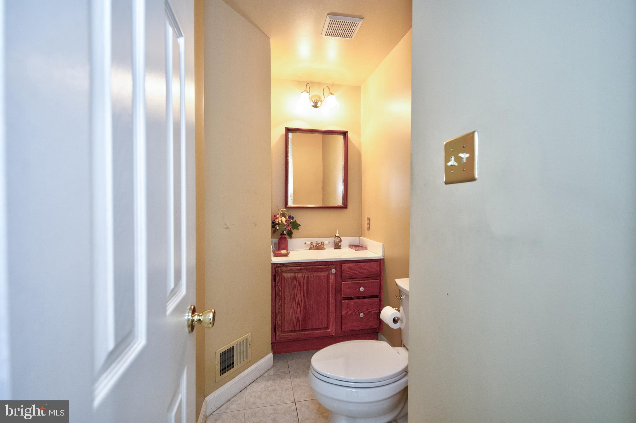 2502 Lady Ann Court Churchville, MD 21028 - Photo 20 of 48 a bathroom with a toilet a sink and mirror