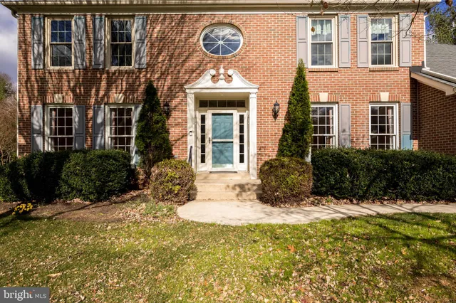 a view of a building with a tree in front