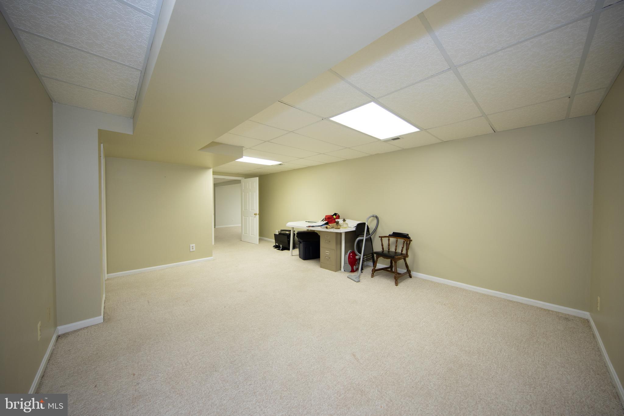 2502 Lady Ann Court Churchville, MD 21028 - Photo 38 of 48 a view of a room with gym equipment and a chandelier