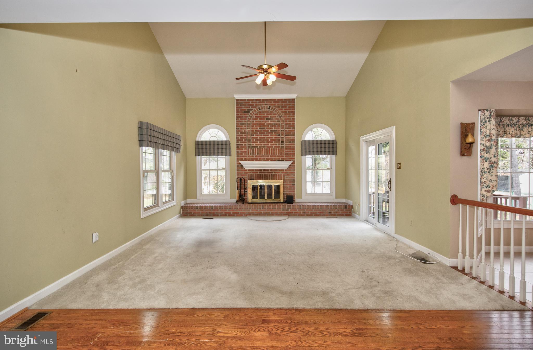 2502 Lady Ann Court Churchville, MD 21028 - Photo 10 of 48 a view of an empty room with a fireplace and a window