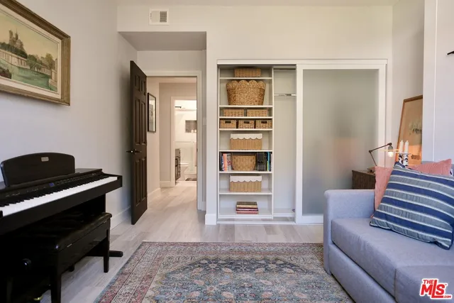 a living room with furniture and a rug
