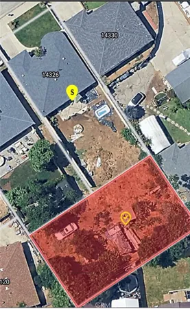 a view of a tennis ground with a large tree