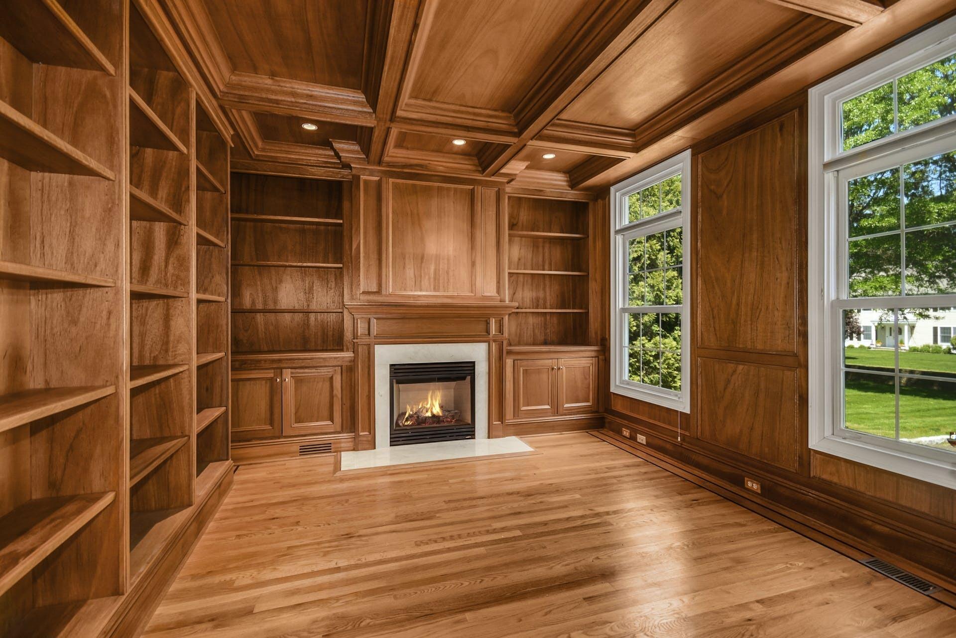 5 Christopher Lane Norwalk, CT 06851 - Photo 11 of 46 a view of a livingroom with wooden floor and a fireplace