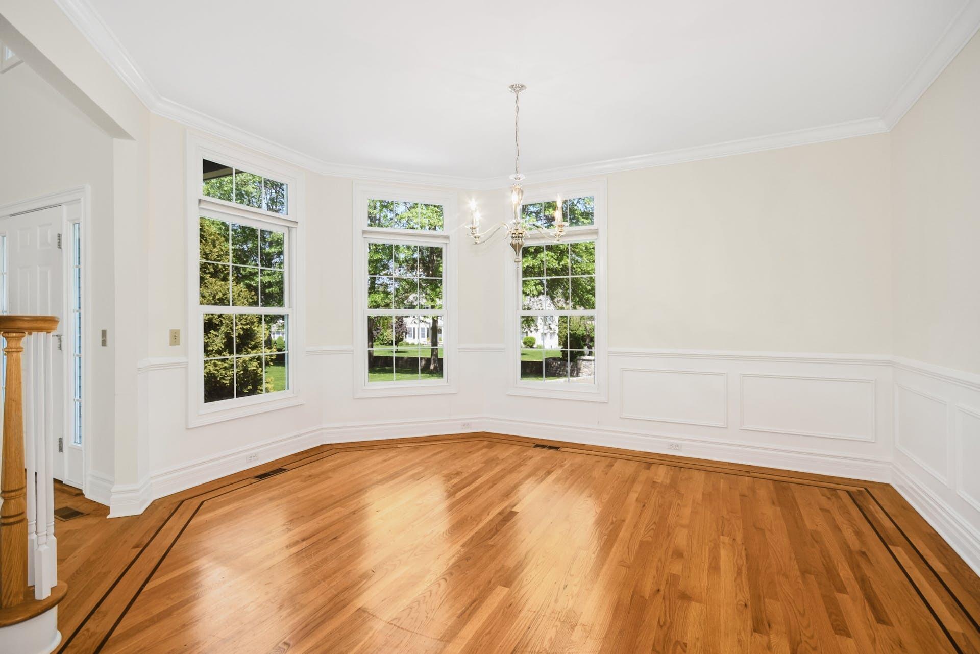 5 Christopher Lane Norwalk, CT 06851 - Photo 14 of 46 a view of empty room with wooden floor and fan