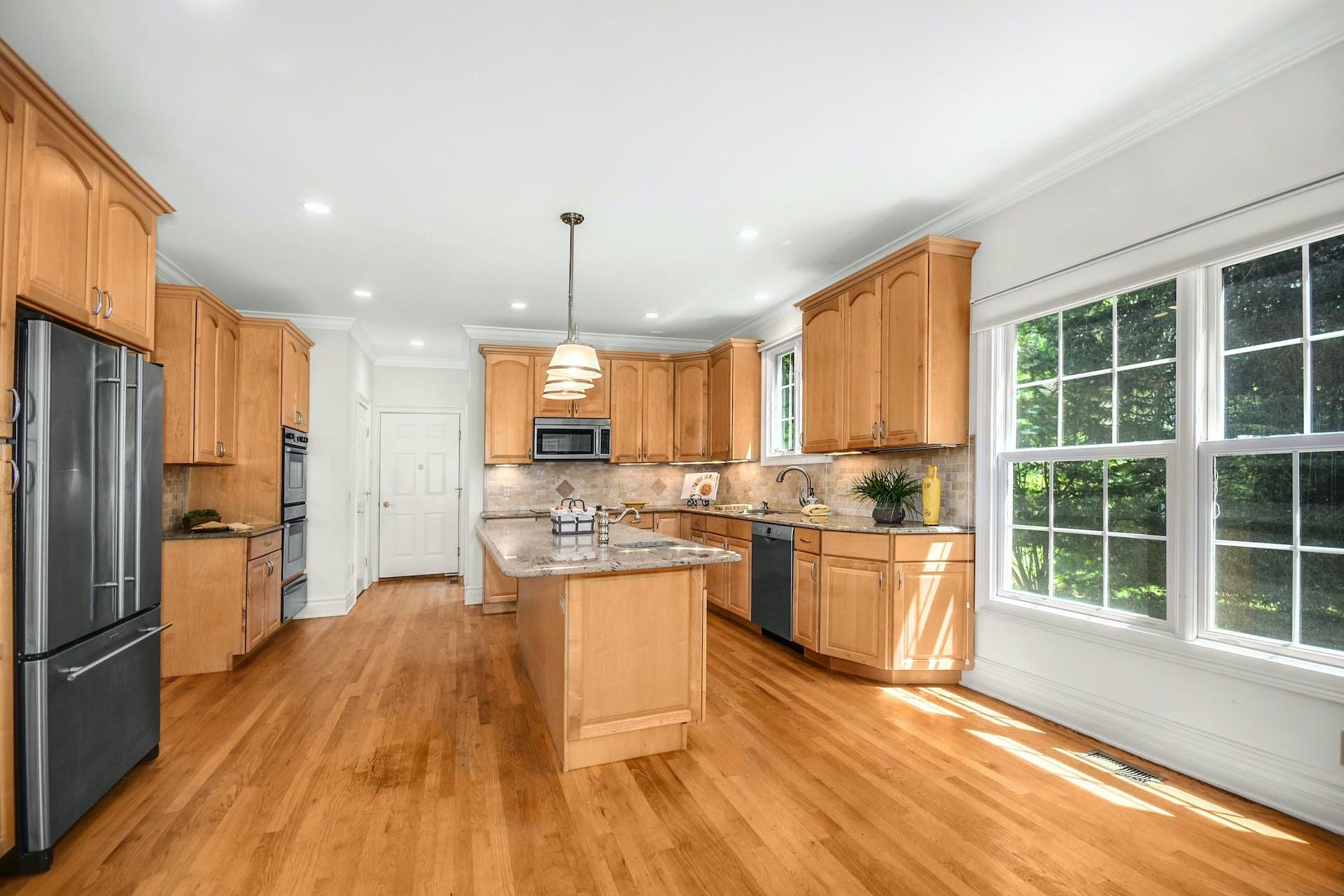 5 Christopher Lane Norwalk, CT 06851 - Photo 16 of 46 a kitchen with a refrigerator a stove top oven and white walls