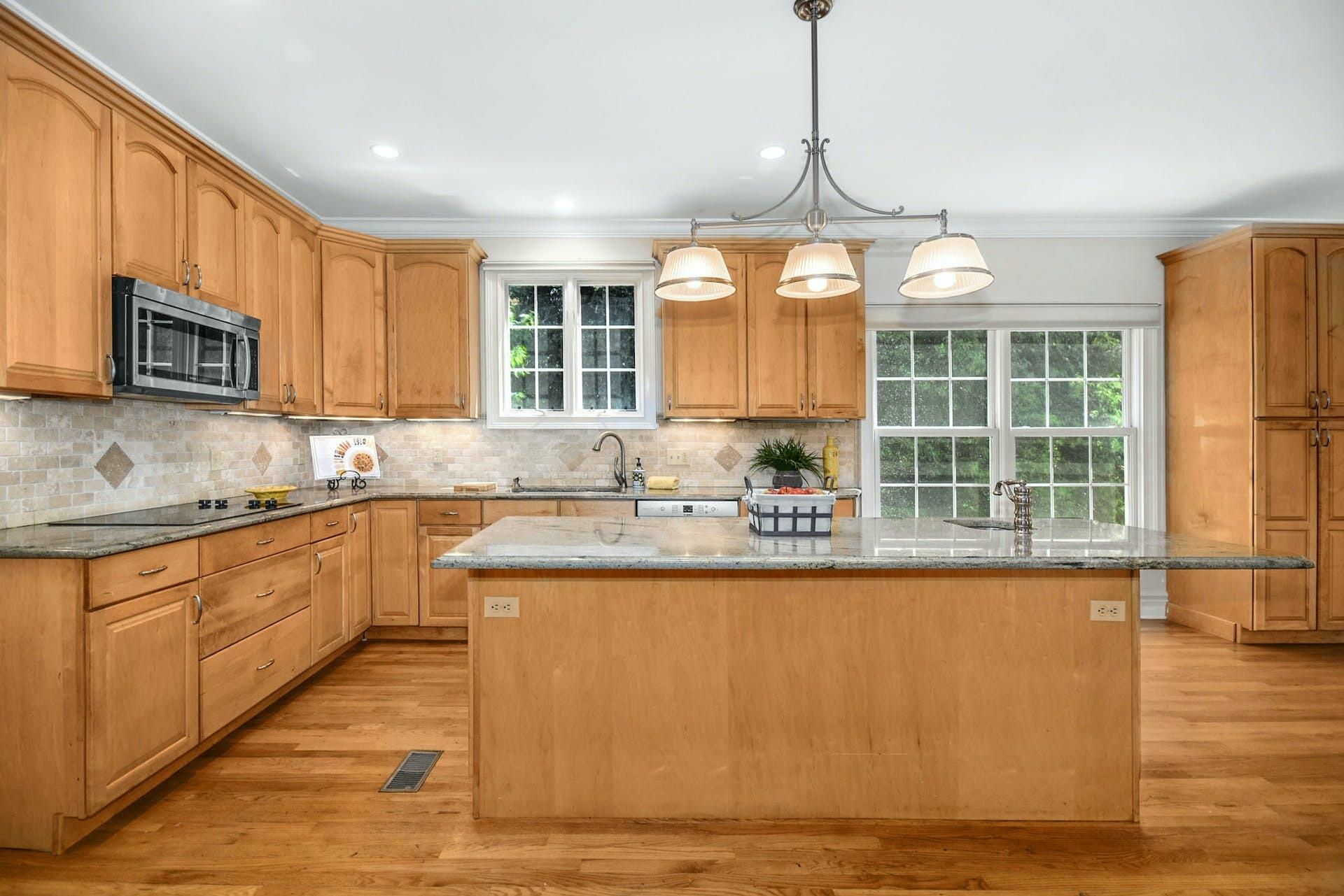 5 Christopher Lane Norwalk, CT 06851 - Photo 18 of 46 a kitchen with stainless steel appliances granite countertop a sink window and cabinets