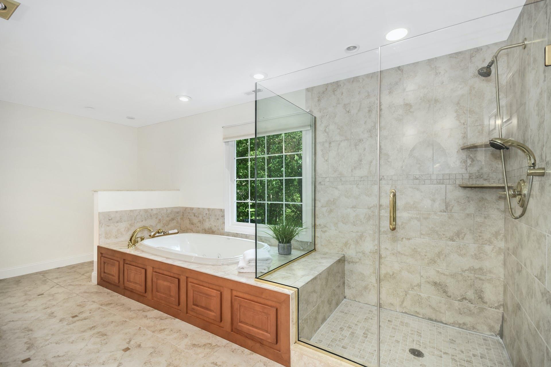 5 Christopher Lane Norwalk, CT 06851 - Photo 25 of 46 a bathroom with a tub sink and shower